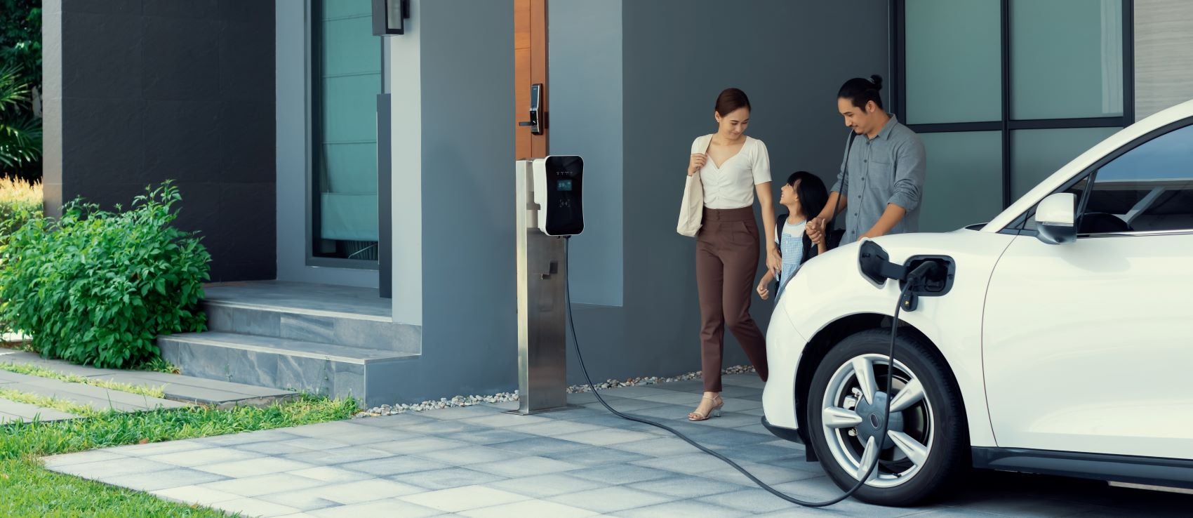 Family With Their Electric Vehicle